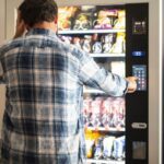 A man using a vending machine